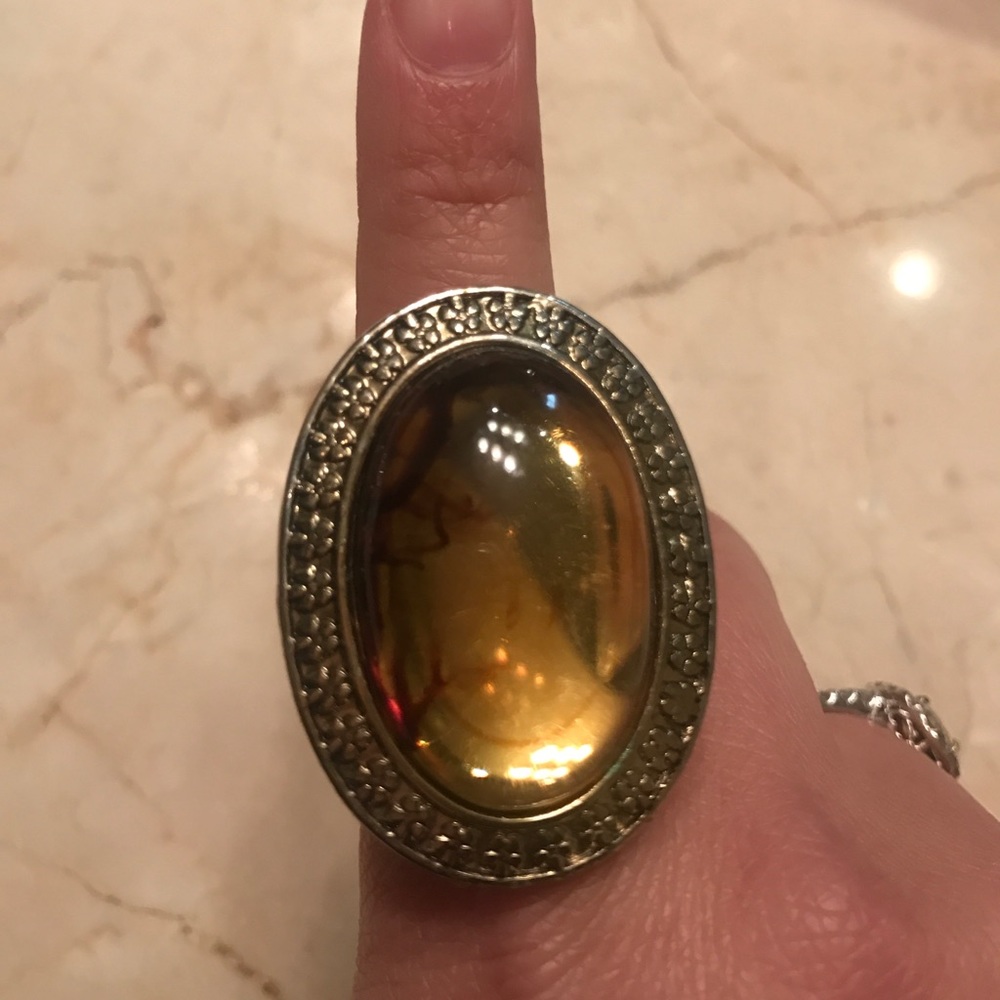 Gold ring with a honey colored gem